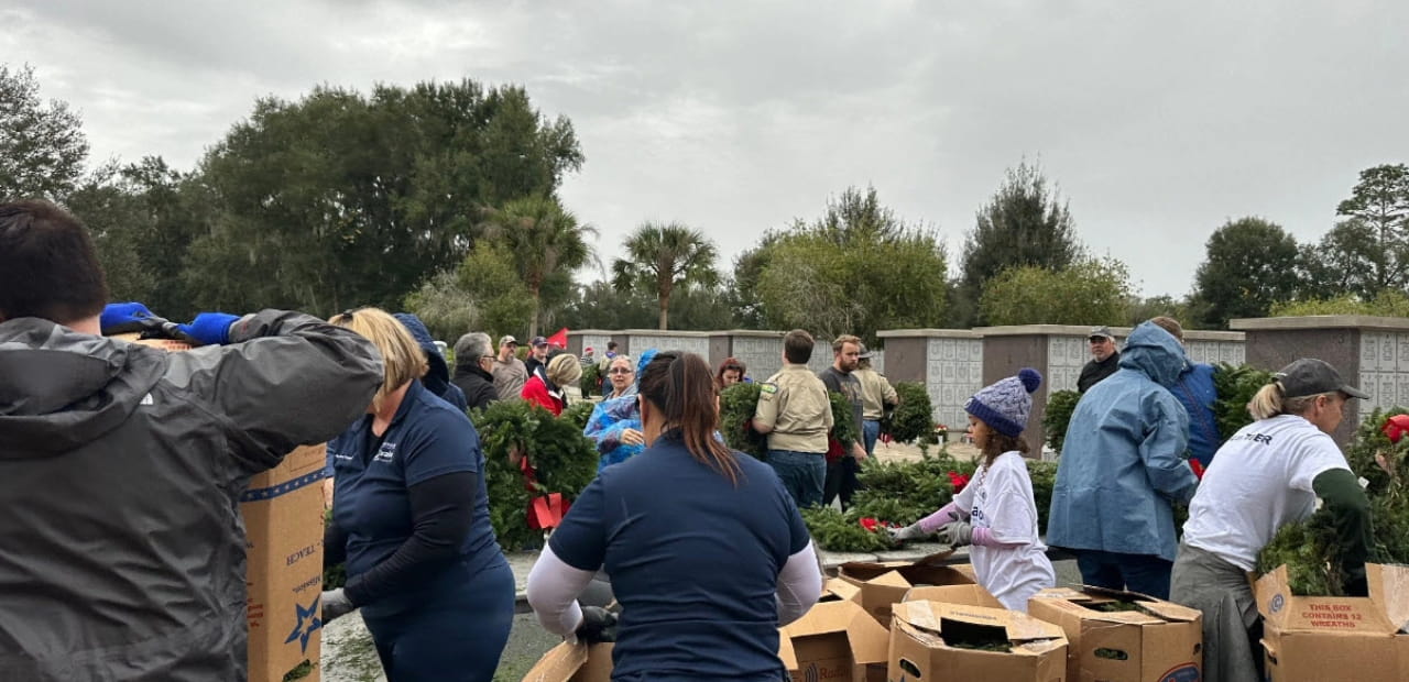 Associates volunteer in Bushnell, FL by putting together wreaths to lay in honor of veterans.